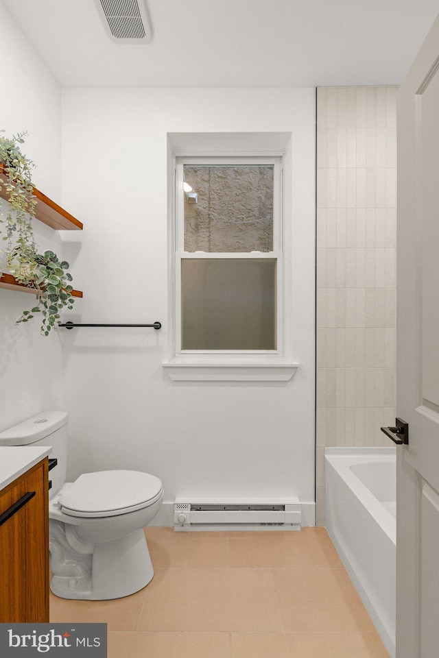 bathroom with tile patterned flooring, vanity, toilet, and a baseboard heating unit