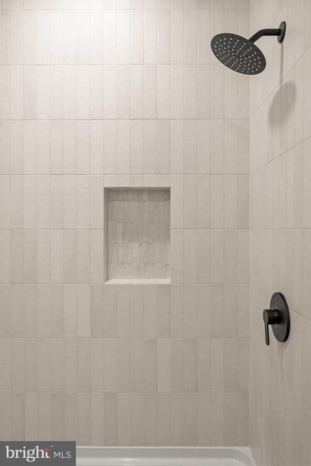 details with a tile shower