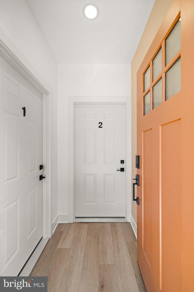 entryway with light hardwood / wood-style flooring