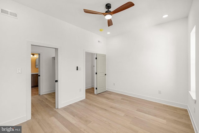 unfurnished bedroom with light wood-type flooring and ceiling fan