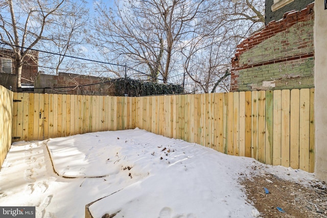 view of yard covered in snow