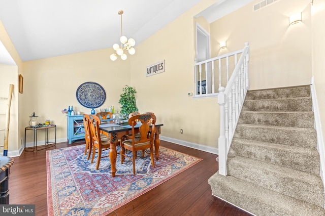 dining room featuring dark hardwood / wood-style floors and a notable chandelier