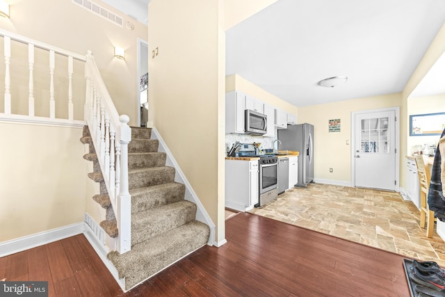 entryway featuring light hardwood / wood-style floors and sink