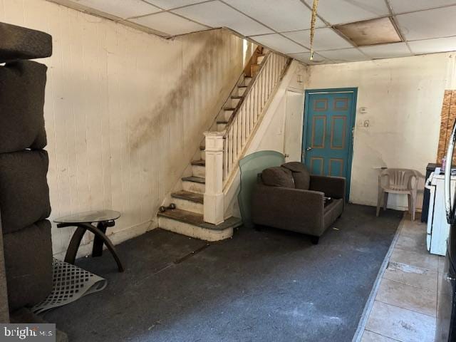 basement featuring a paneled ceiling