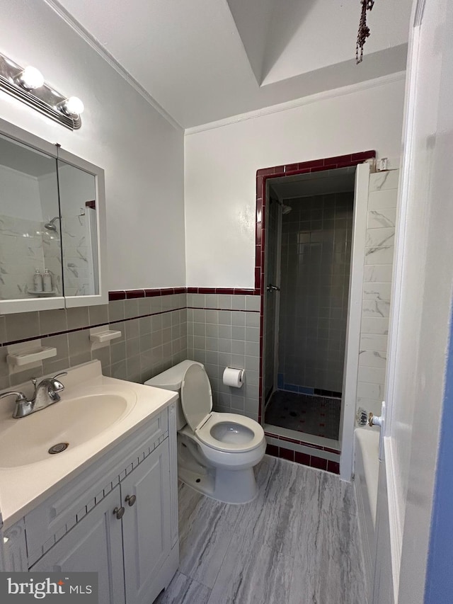 full bathroom featuring vanity, independent shower and bath, tile walls, and toilet