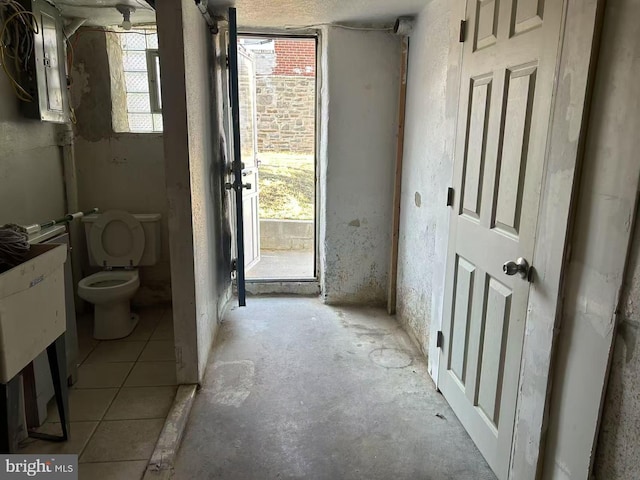 bathroom with electric panel and toilet