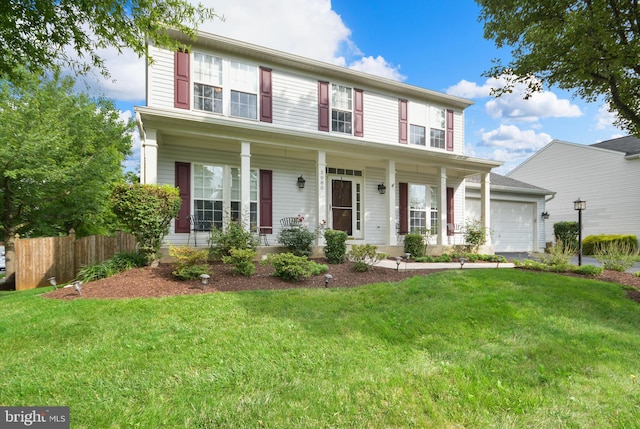 view of front of house with a front lawn and a garage