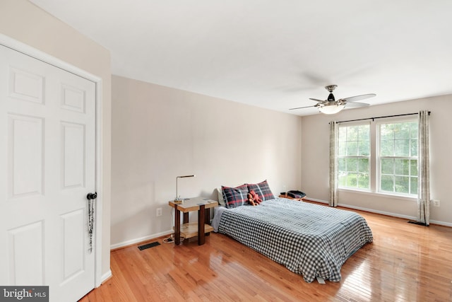 bedroom featuring light hardwood / wood-style floors and ceiling fan