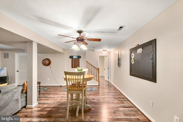 dining area with ceiling fan and dark hardwood / wood-style floors