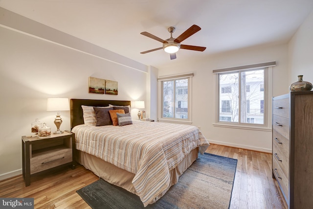 bedroom featuring light hardwood / wood-style flooring and ceiling fan