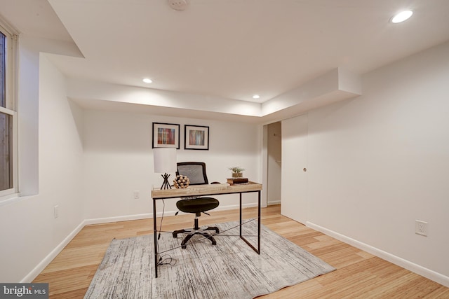 office with light hardwood / wood-style floors