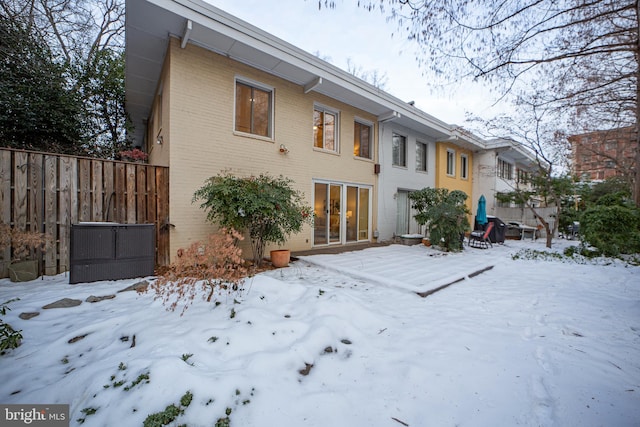 view of snow covered house