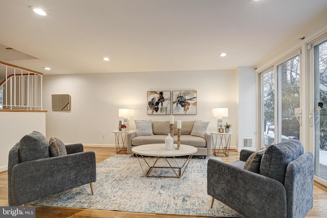 living room with light hardwood / wood-style flooring