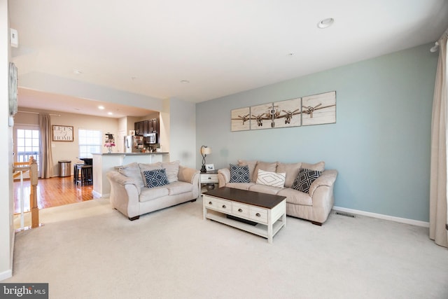 living room featuring light colored carpet