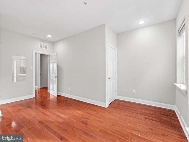 empty room featuring hardwood / wood-style floors