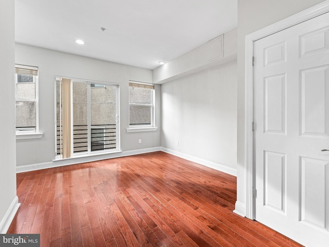 spare room featuring hardwood / wood-style floors