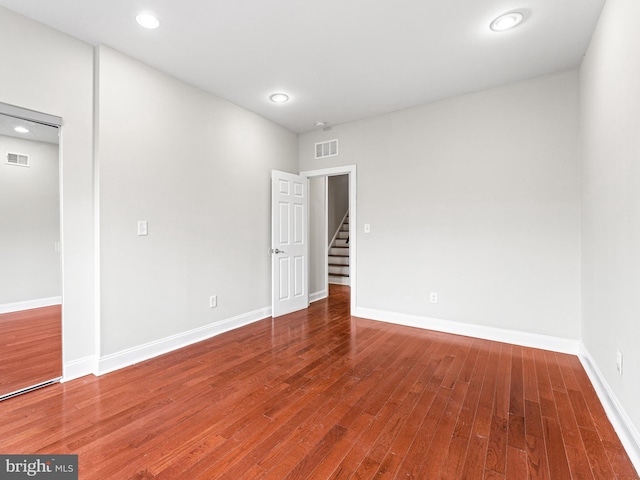 empty room featuring hardwood / wood-style flooring