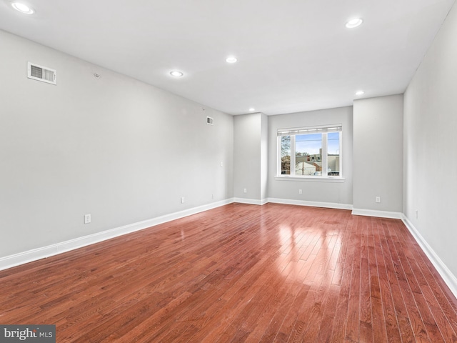 unfurnished room featuring wood-type flooring