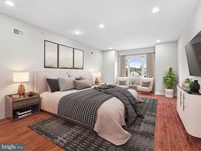 bedroom with hardwood / wood-style flooring