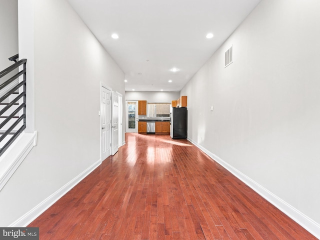 unfurnished living room with hardwood / wood-style flooring