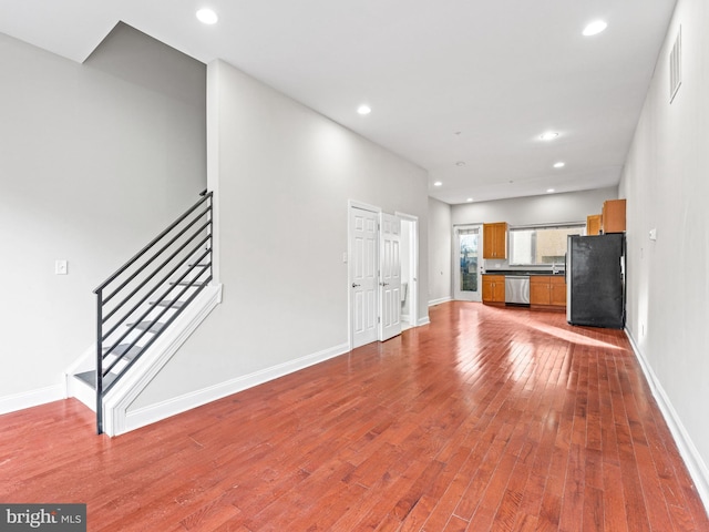 unfurnished living room with hardwood / wood-style flooring