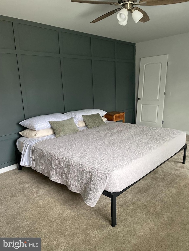 carpeted bedroom featuring ceiling fan