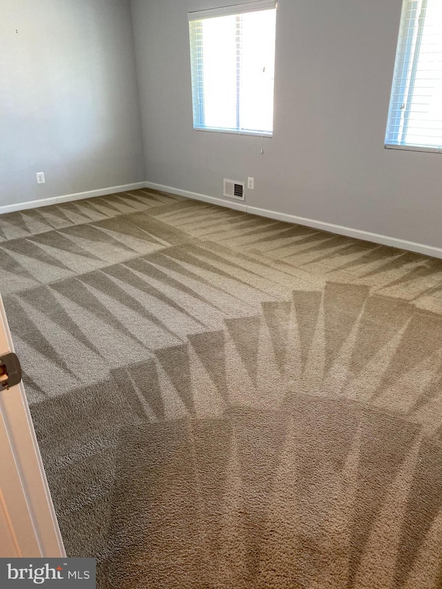 unfurnished room with carpet floors