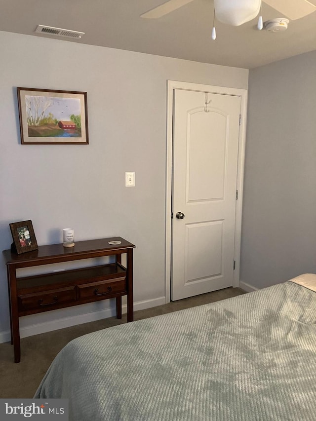 carpeted bedroom with ceiling fan