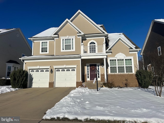 view of front of home with a balcony and a garage