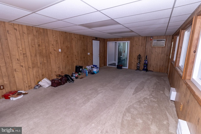 interior space featuring a baseboard radiator and wooden walls