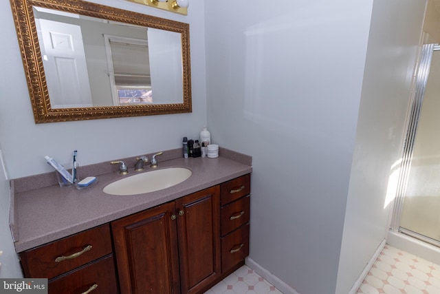 bathroom with vanity and a shower with shower door