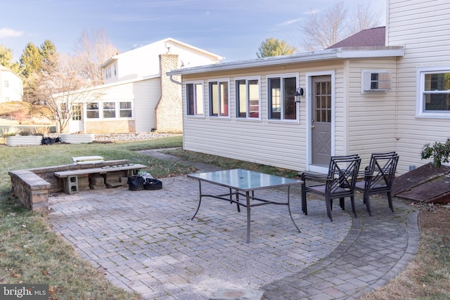 back of property featuring a patio