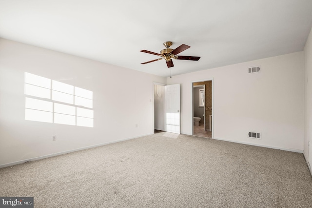 unfurnished bedroom with carpet, ensuite bath, and ceiling fan