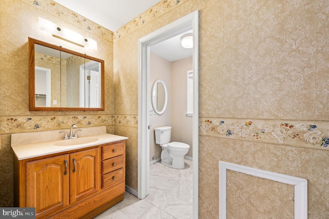 bathroom with vanity and toilet