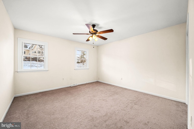 carpeted empty room with ceiling fan