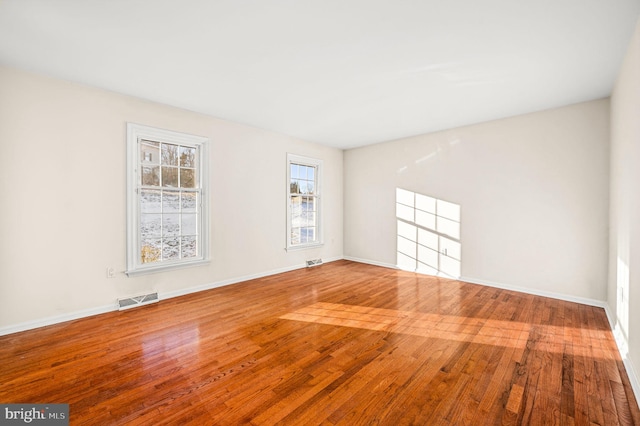 unfurnished room featuring hardwood / wood-style floors