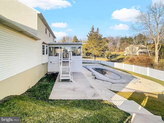 view of patio / terrace featuring a sunroom