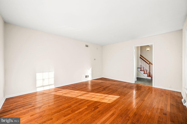 empty room featuring hardwood / wood-style floors