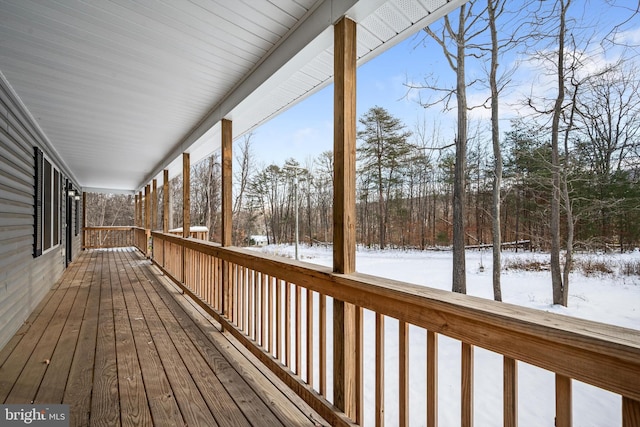 view of snow covered deck