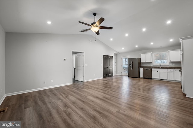 unfurnished living room featuring ceiling fan, sink, high vaulted ceiling, and hardwood / wood-style flooring