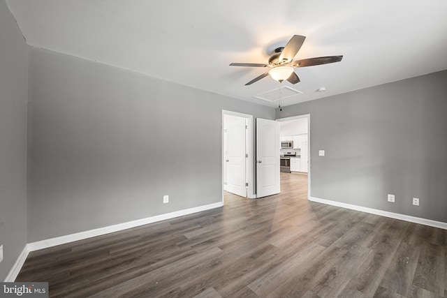 empty room with dark hardwood / wood-style floors