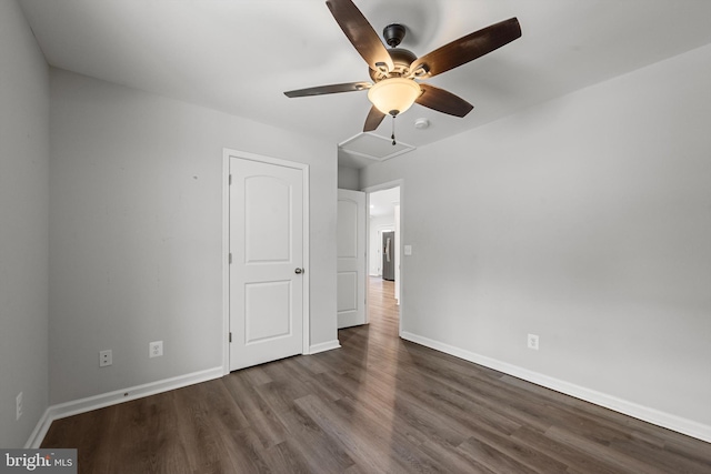 unfurnished bedroom with dark hardwood / wood-style floors and ceiling fan