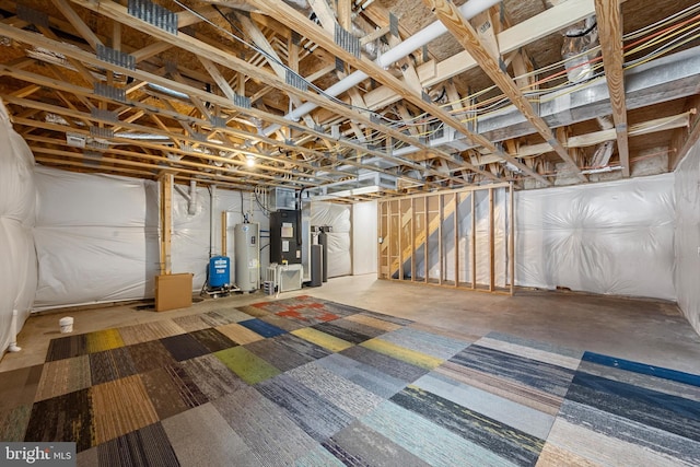 basement featuring heating unit and water heater