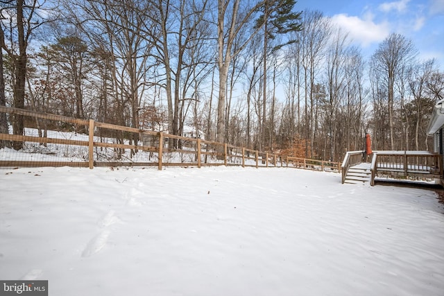 view of yard layered in snow