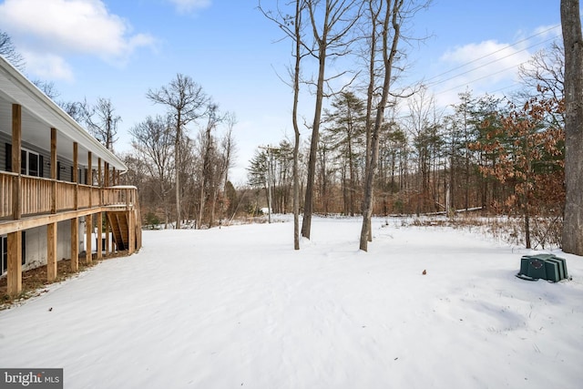 view of yard layered in snow