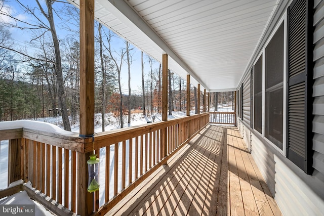 view of snow covered deck