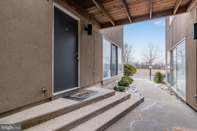 entrance to property featuring a patio area