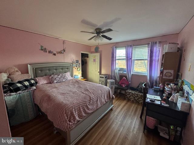 bedroom featuring ceiling fan and hardwood / wood-style flooring