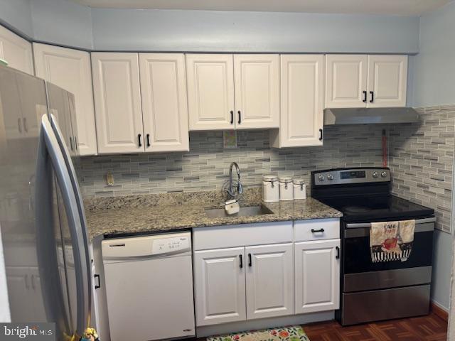 kitchen featuring white cabinets, sink, and appliances with stainless steel finishes