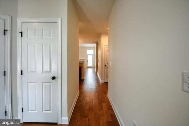 corridor featuring dark hardwood / wood-style flooring